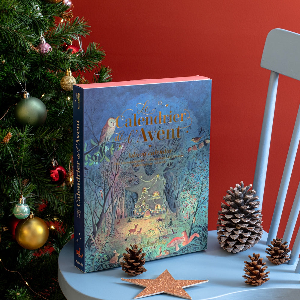 Moulin Roty La Grande Famille advent calendar box on chair with holiday decor