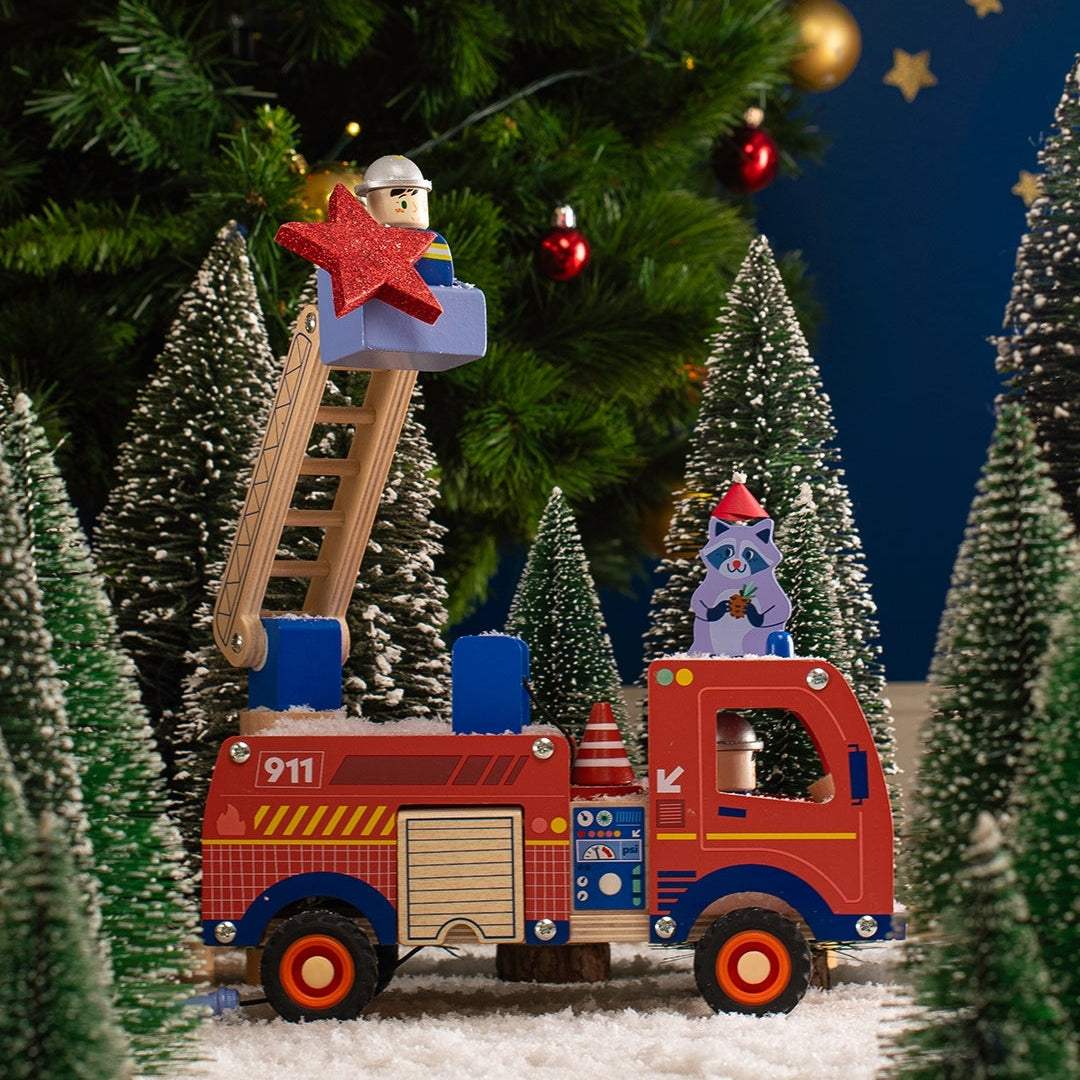 Moulin Roty Avenue du Moulin wooden fire truck with ladder and firefighter figures in winter scene