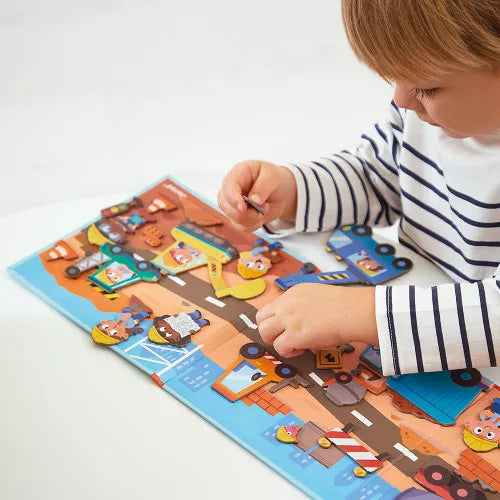Child playing with Janod Magnéti'stories construction site magnetic story game