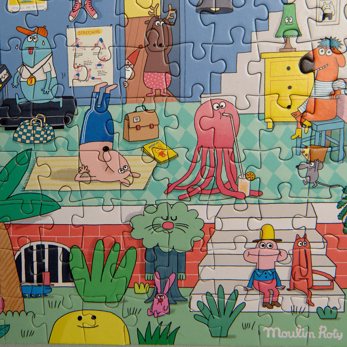 Detail of gym scene in assembled Les Schmouks puzzle showing octopus and yoga monster characters