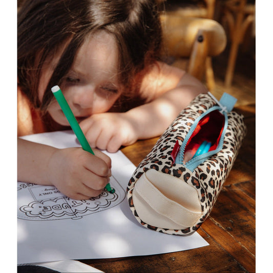 Child coloring with Hello Hossy leopard pencil case on wooden table