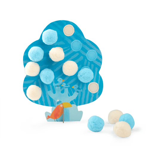 Blue winter themed cardboard tree from Les Toupitis set decorated with light blue and white pom-poms