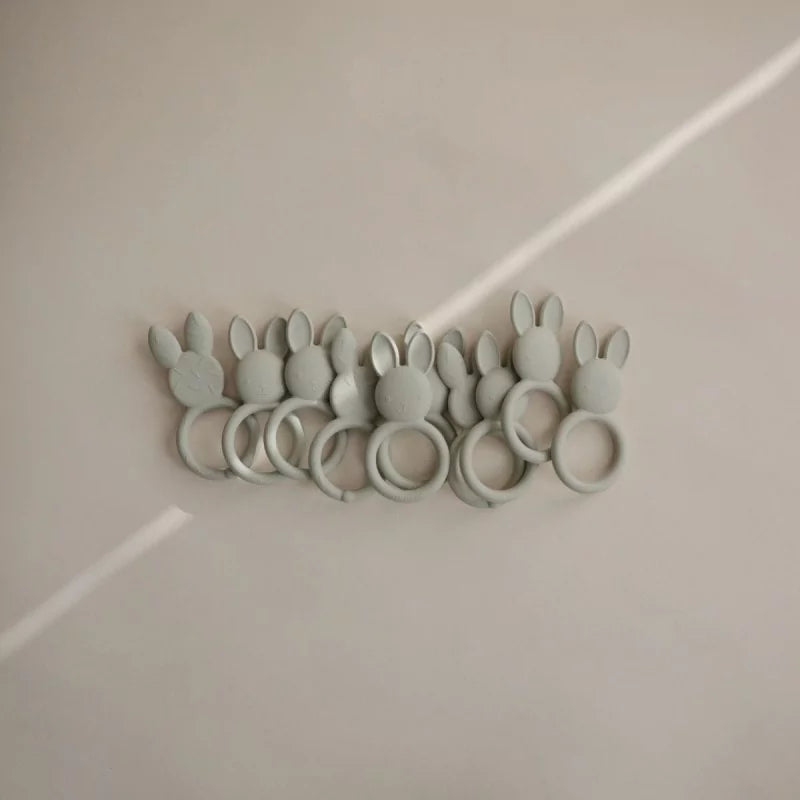 Row of sage green rabbit silicone teethers