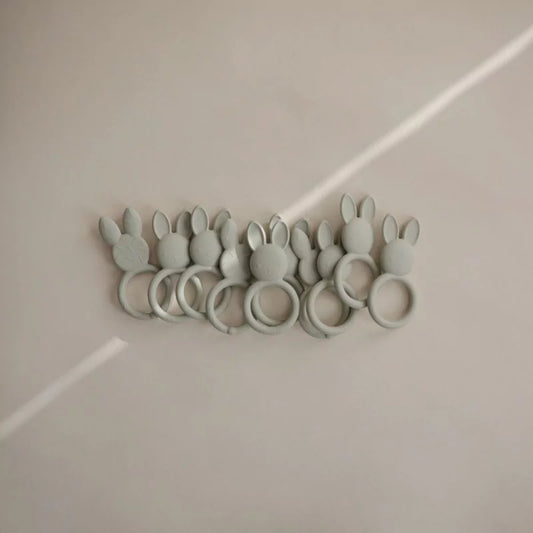 Row of sage green rabbit silicone teethers
