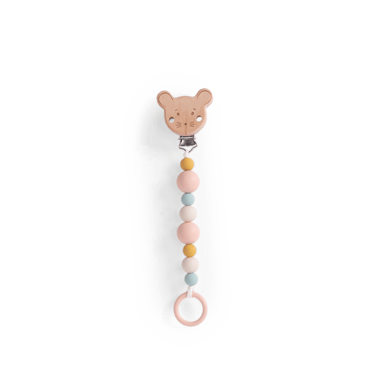 Close-up of wooden mouse head pacifier holder with engraved details