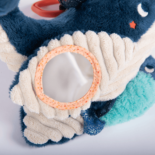 Paulie musical whale plush with hidden mirror and textured belly