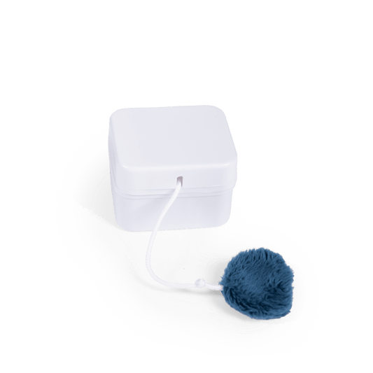 White square music box unit with dark blue faux fur pull string