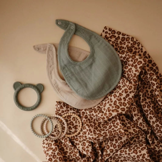 MUSHIES muslin bibs styled with wooden beads and teether