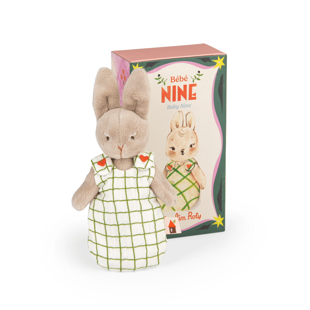 Bébé Nine plush toy standing next to illustrated packaging box showing character art