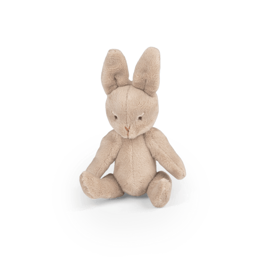 Bébé Nine articulated plush rabbit doll sitting upright with soft fuzzy texture