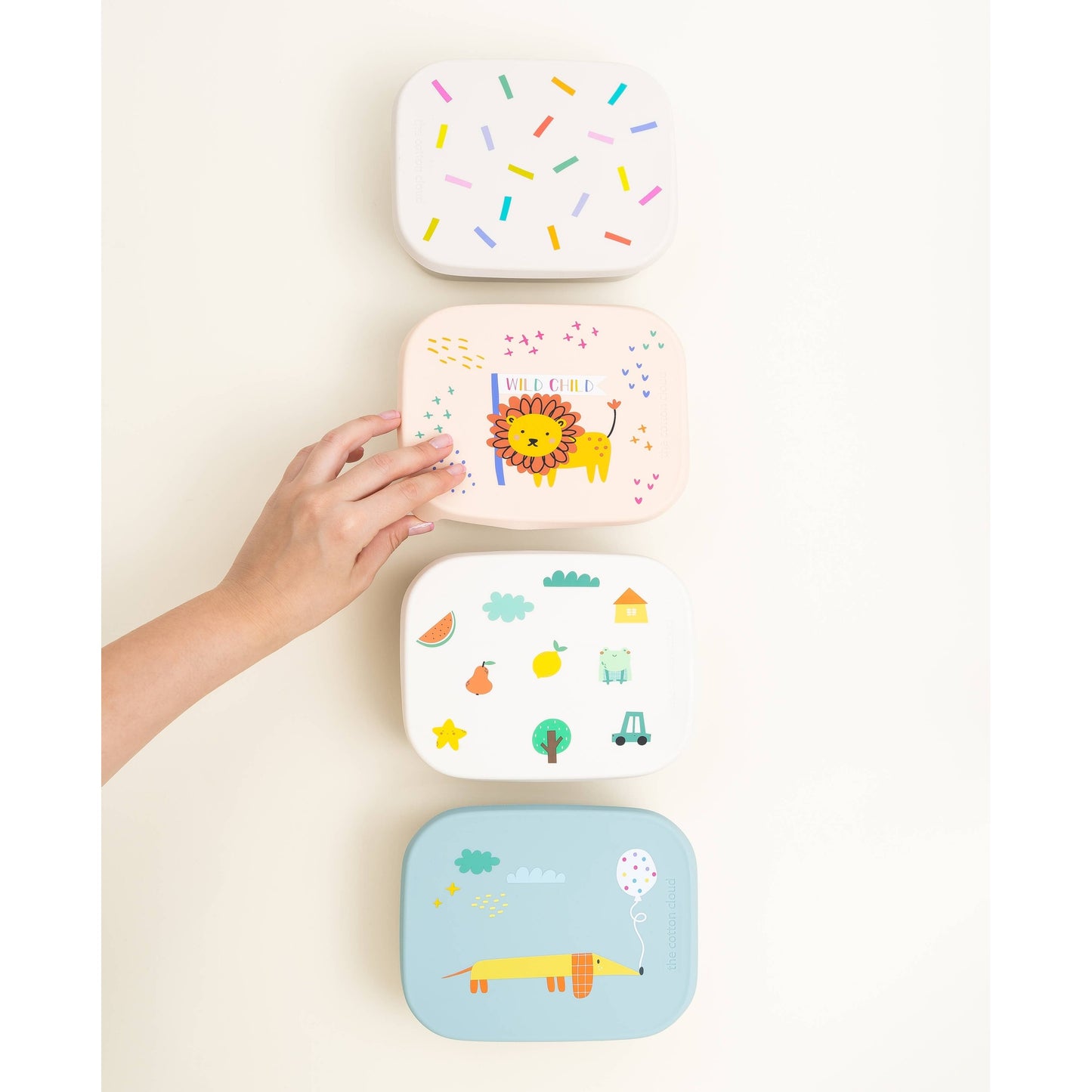 Stack of three removable silicone lunchbox lids with animal prints