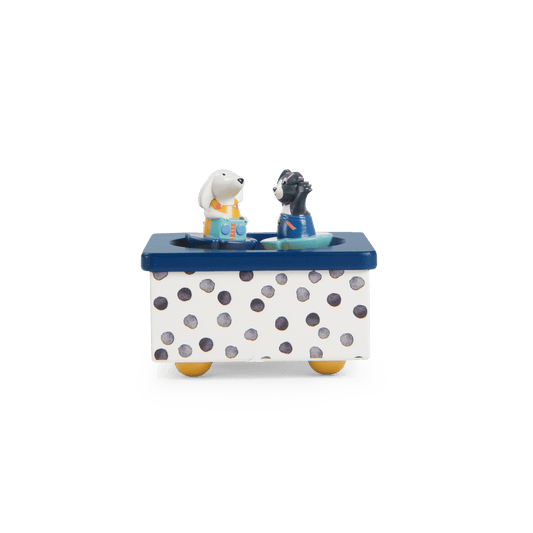 Front view of white and navy polka dot music box