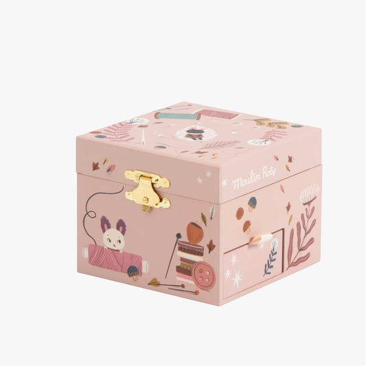 Moulin Roty pink music box side view with small storage drawer and mushroom details