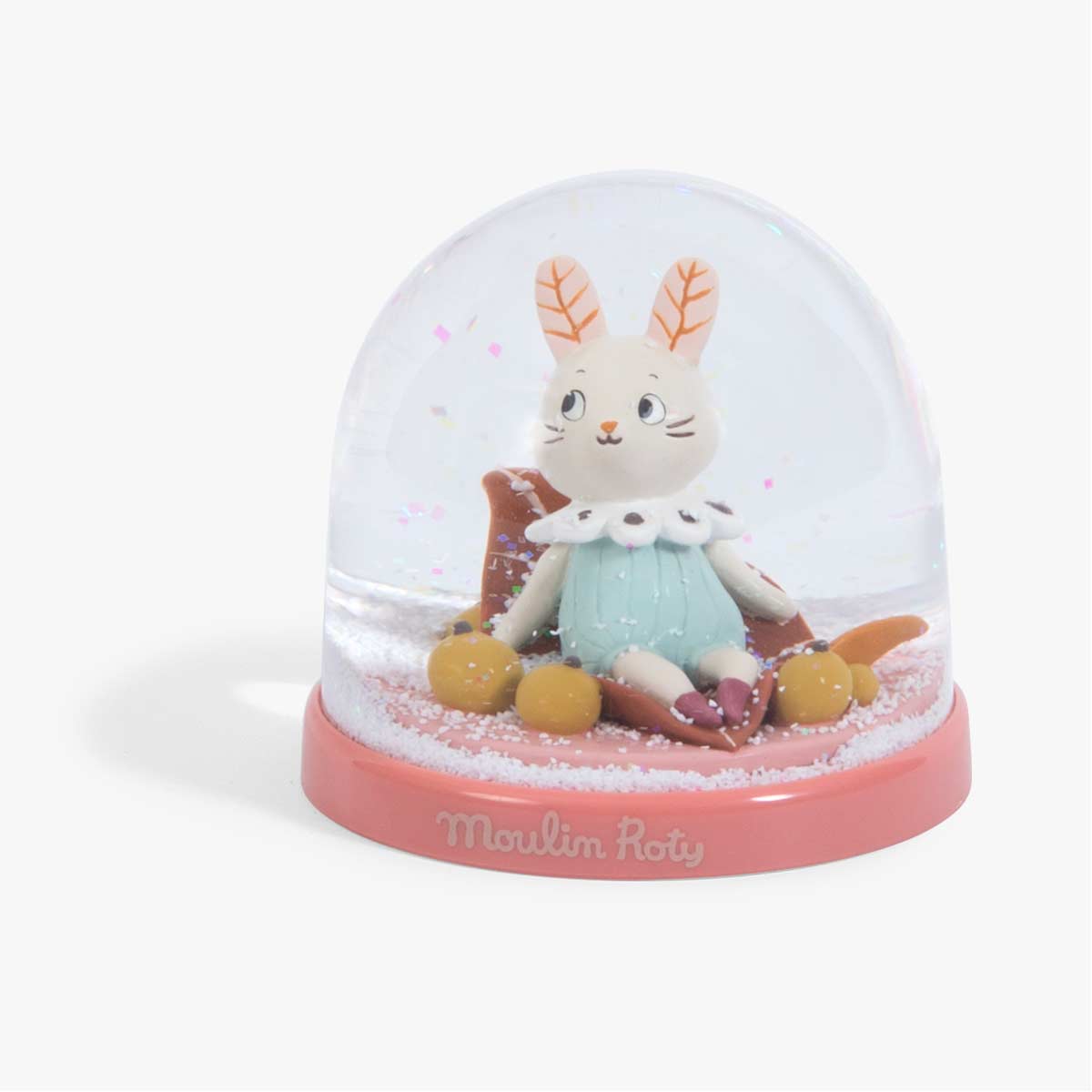 Close-up of Moulin Roty snow globe rabbit figurine with mint green dress and glitter