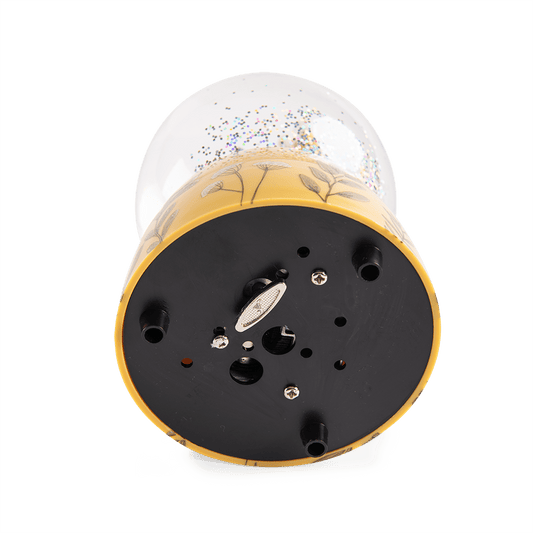 Bottom speaker grille and feet of Moulin Roty musical snow globe