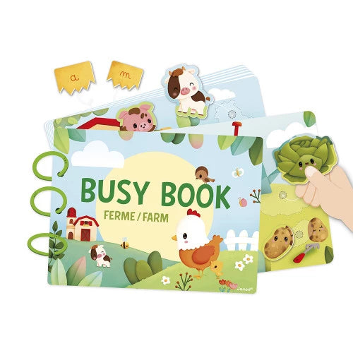 Janod Farm Busy Book open with cow chicken pig cutouts and green spiral binding