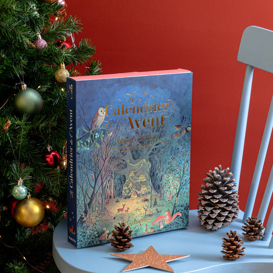 Moulin Roty La Grande Famille advent calendar box on chair with holiday decor
