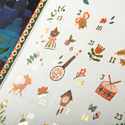 Close-up of die-cut number flaps on Les Minouchkas advent calendar pocket page