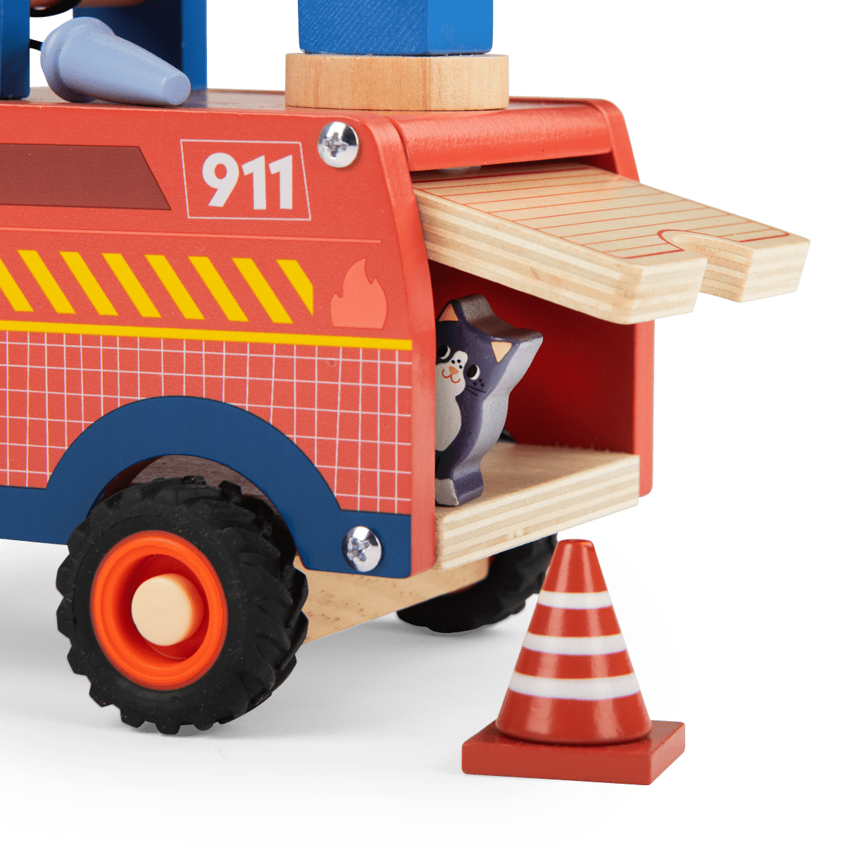 Close-up of open side compartment on red wooden fire truck revealing grey cat figure