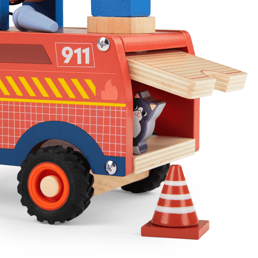 Close-up of open side compartment on red wooden fire truck revealing grey cat figure