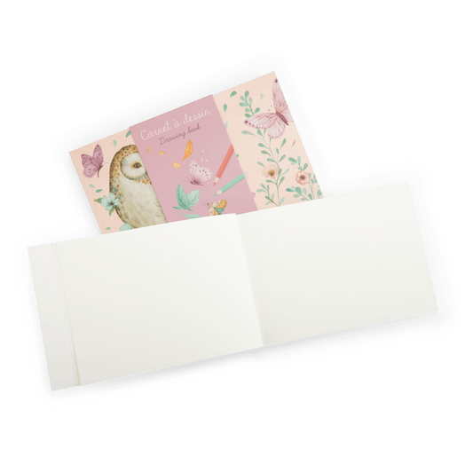 Open Moulin Roty sketchbook showing thick cream paper pages for children
