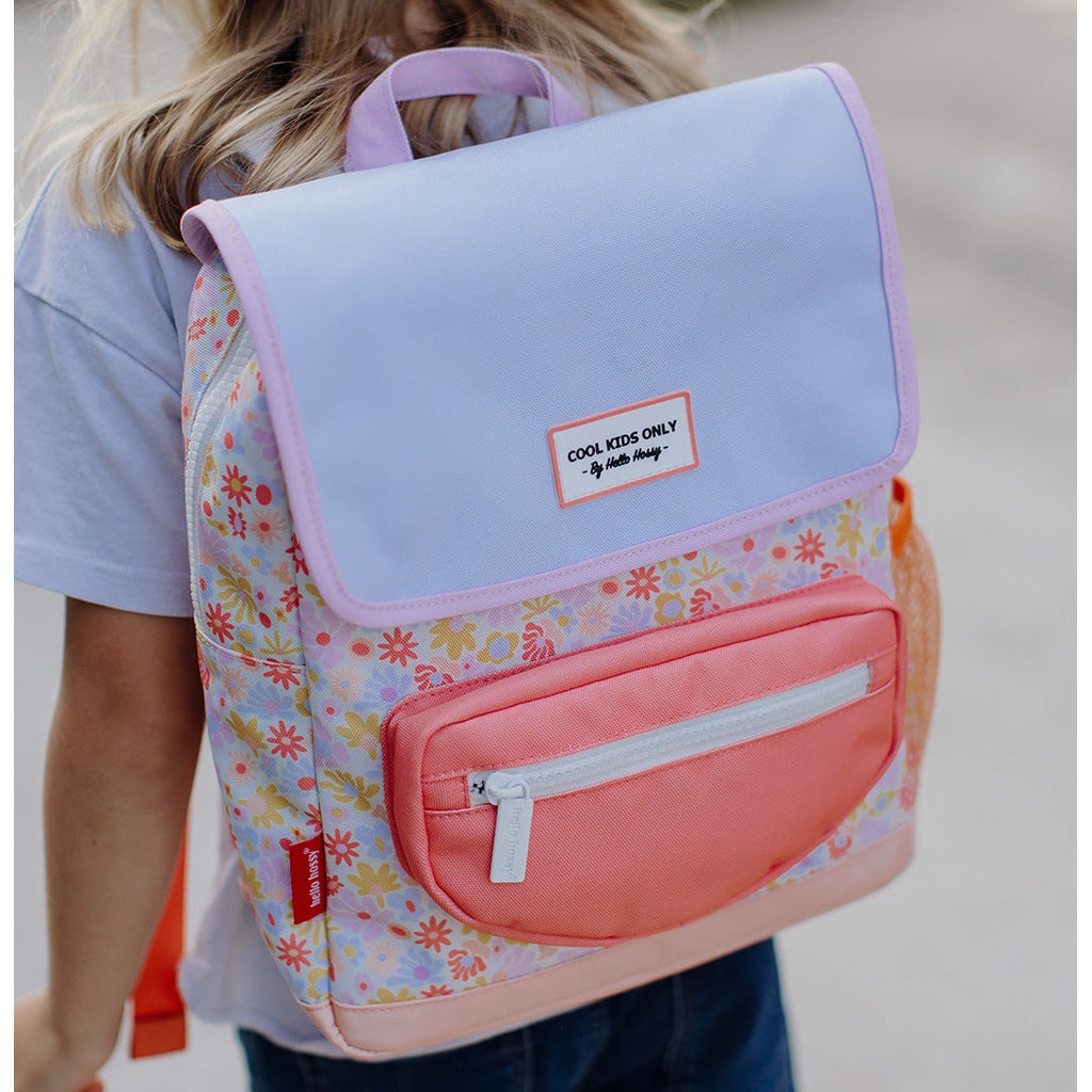 Back view of child wearing Hello Hossy retro floral school bag