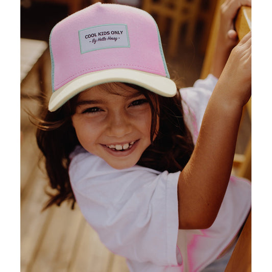 Pastel pink and light blue Hello Hossy trucker cap on girl