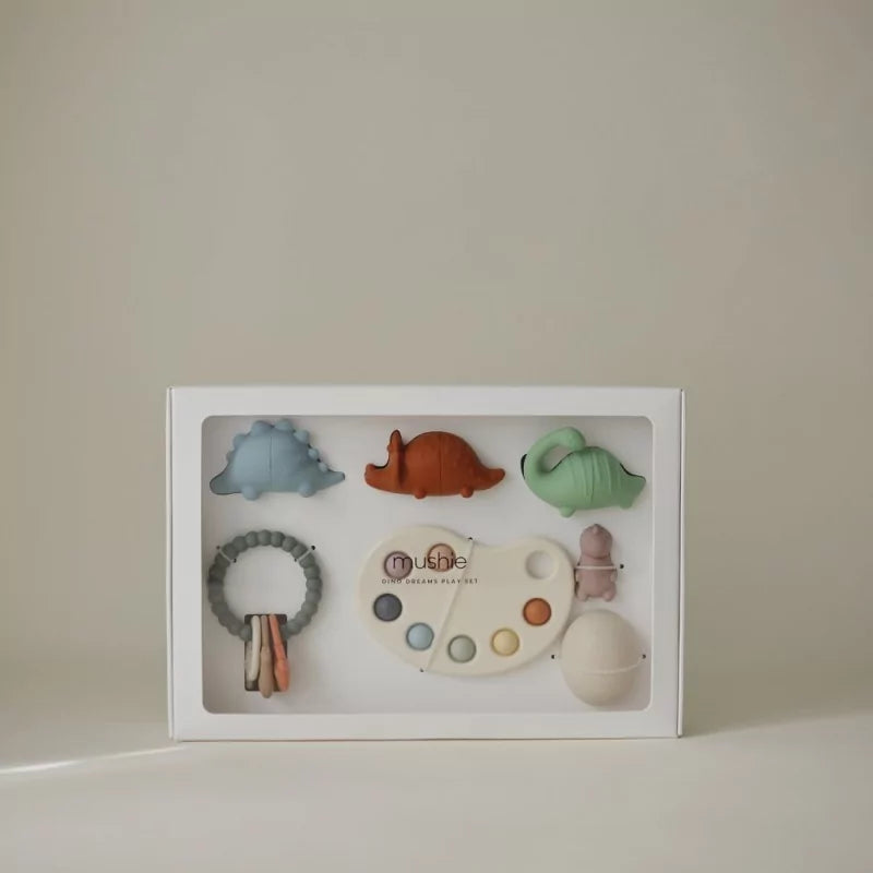 Closed white MUSHIES Dino Dreams gift box showing silicone dinosaur toys