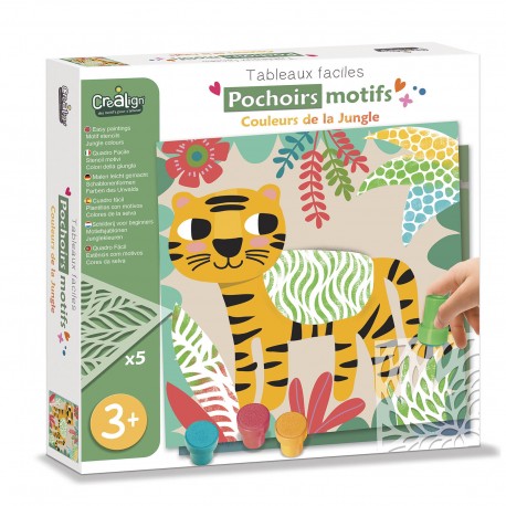 Child using green jungle stencil on yellow tiger artwork with paint pots