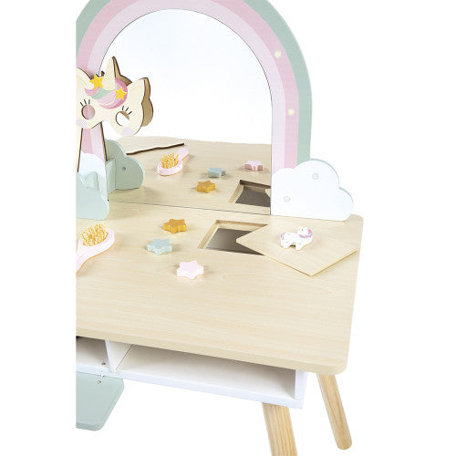 Close-up of natural wood grain surface on Janod unicorn vanity with accessories