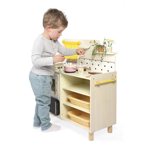 Boy using full size Mamie Soleil wooden play kitchen with oven