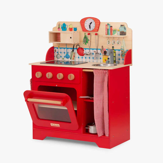 Open oven interior of red wooden play kitchen with storage shelves
