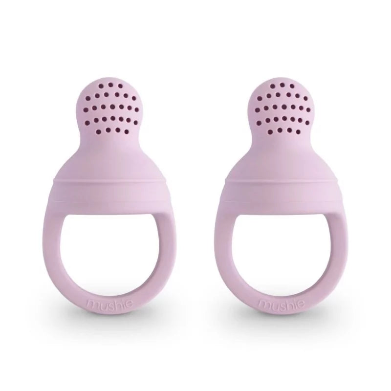 Two soft lilac silicone baby food feeders standing upright
