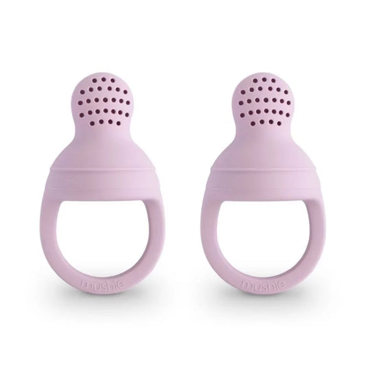 Two soft lilac silicone baby food feeders standing upright