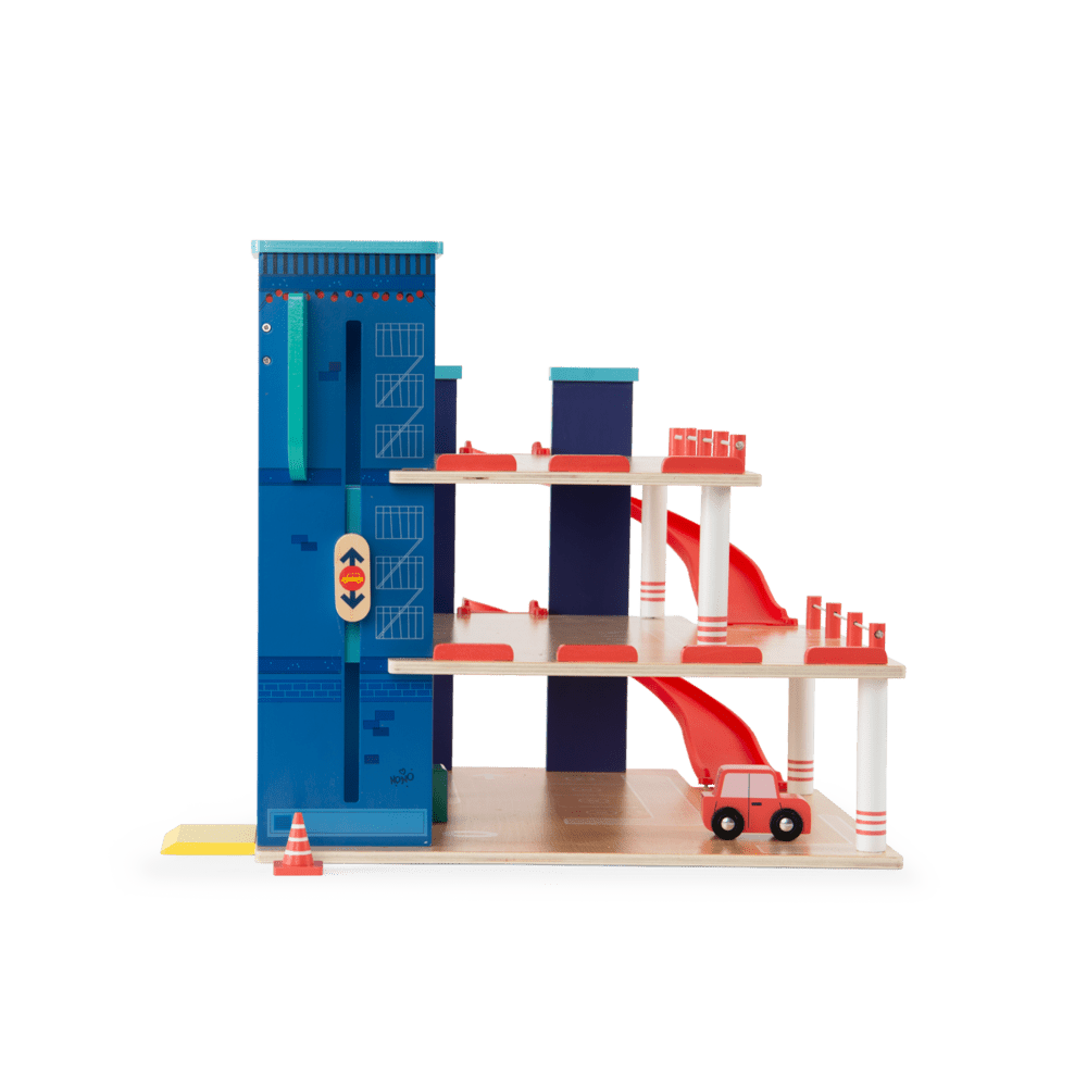 Side view of Moulin Roty multi-level wooden car garage showing slide ramps and elevator mechanism