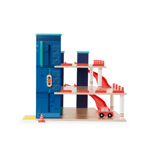 Side view of Moulin Roty multi-level wooden car garage showing slide ramps and elevator mechanism