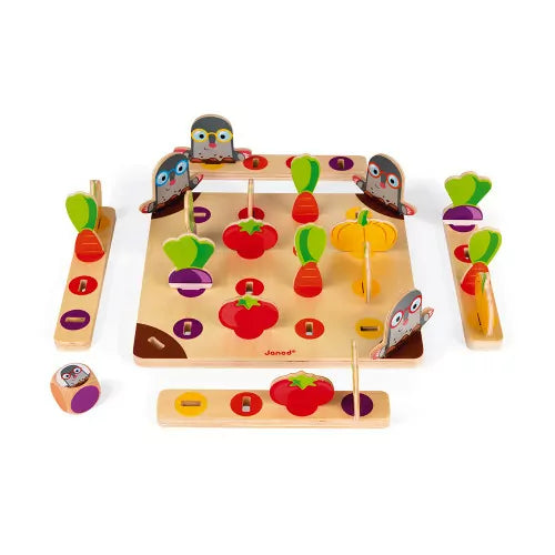 Overhead view of Garden Panic board game setup with wooden mole figures