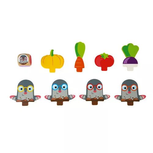 Flat lay of JANOD Garden Panic wooden game components including die and moles