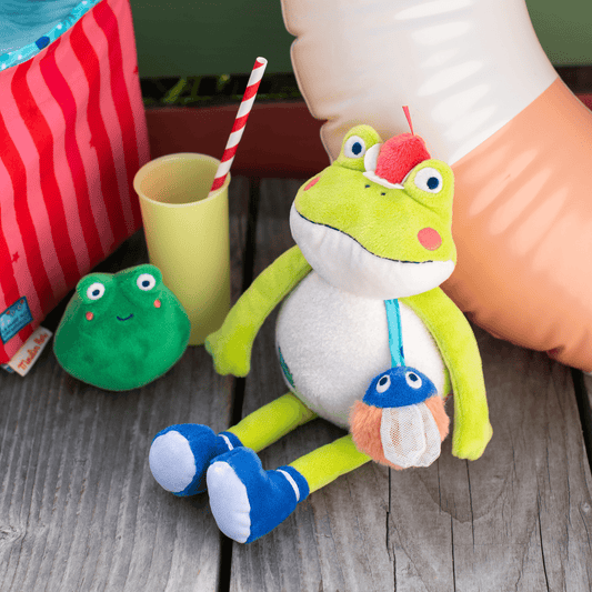Régina the green plush frog toy with mushroom accessory on strap