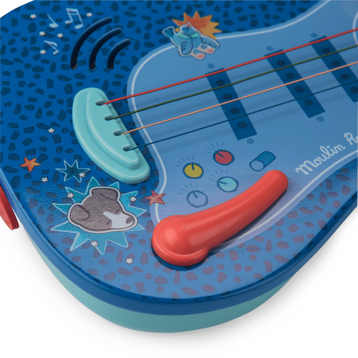 Close-up of toy guitar bridge, colored strings, and star graphics