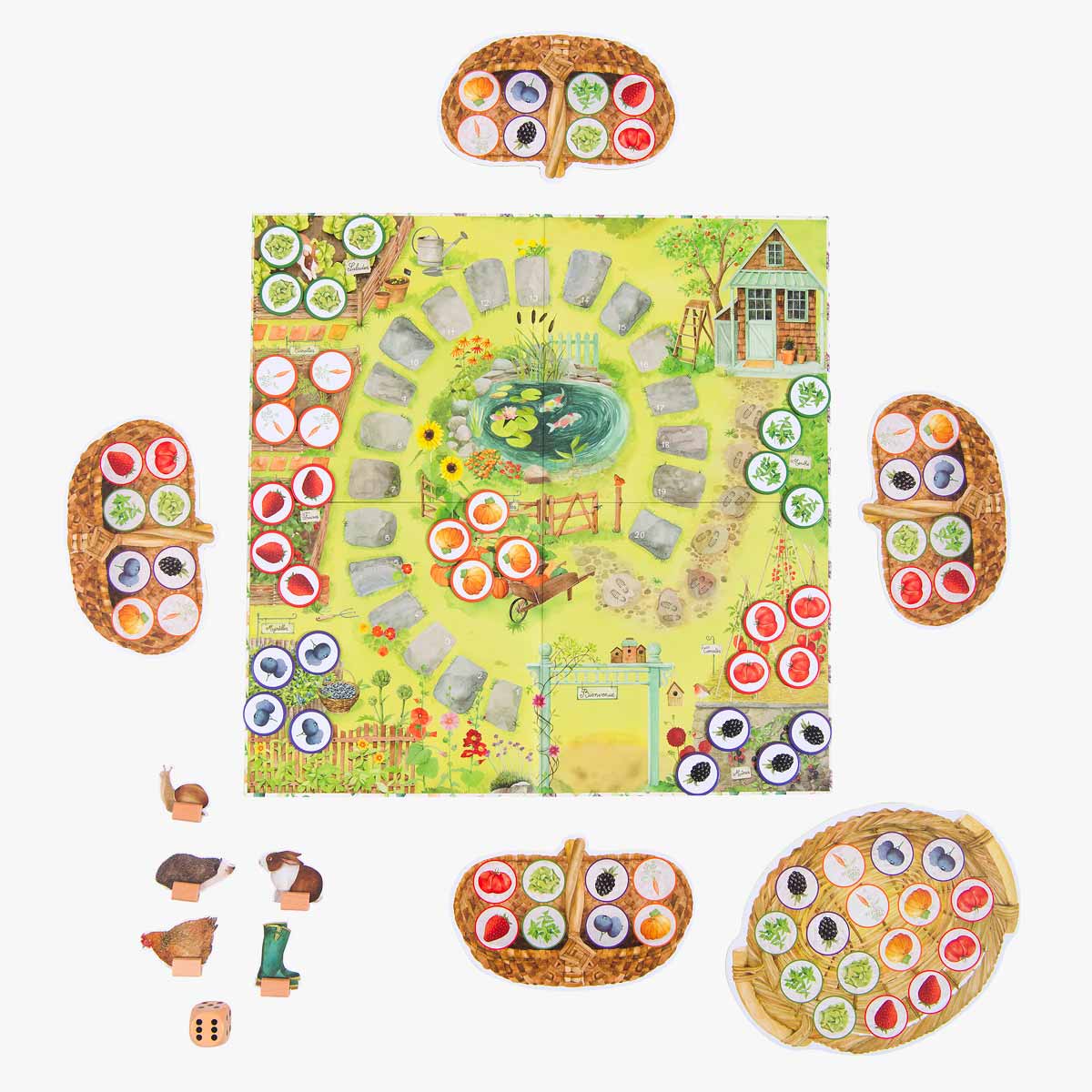 Moulin Roty garden picnic board game setup with character figurines and vegetable tokens