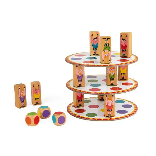 Close-up of balanced wooden acrobats on multi-colored polka dot discs during gameplay