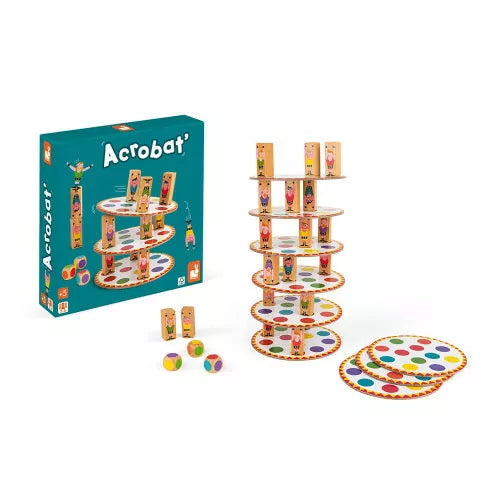 Acrobat board game box next to assembled five-tier wooden tower with dice for ages 5+