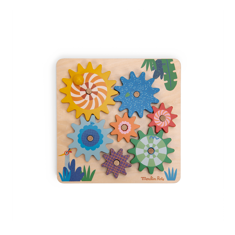 Assembled Moulin Roty Les Toupitis wooden gear board with seven colorful interlocking cogs