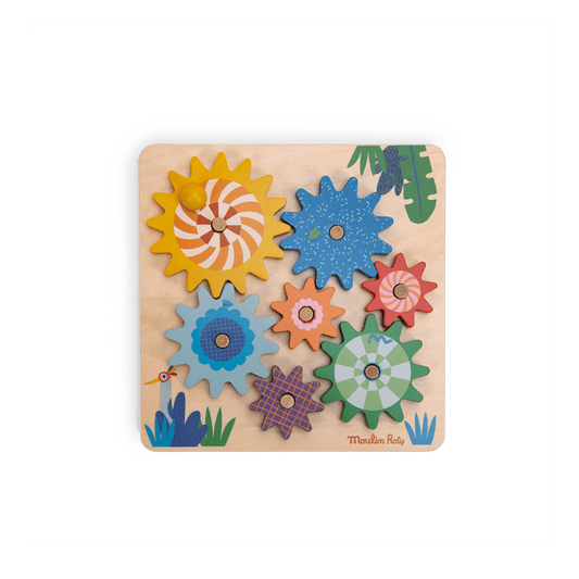 Assembled Moulin Roty Les Toupitis wooden gear board with seven colorful interlocking cogs