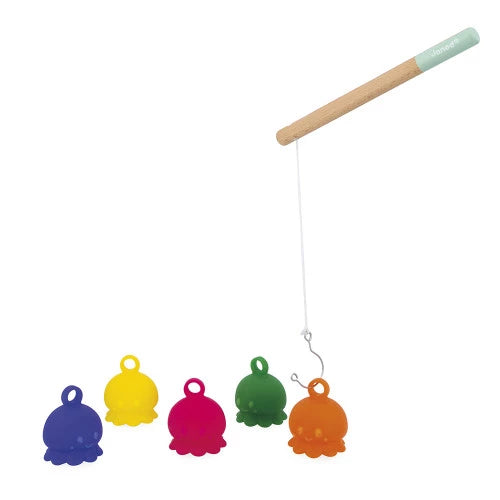 Child catching orange octopus toy with JANOD wooden fishing rod