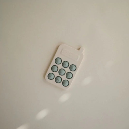 MUSHIES Cambridge Blue silicone press-toy phone with sage green buttons