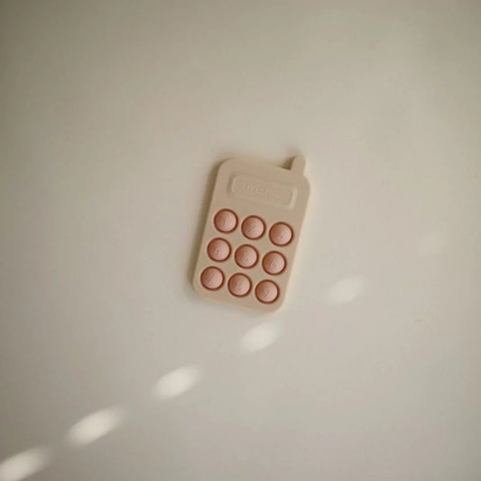 Mushie Blush Silicone Pop-It Phone Toy with Numbered Buttons