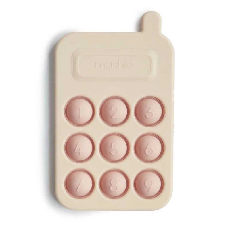 Close-up of Mushie Beige and Blush Silicone Pop-Phone Detail
