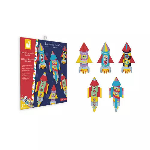 Five colorful assembled paper rockets next to JANOD packaging
